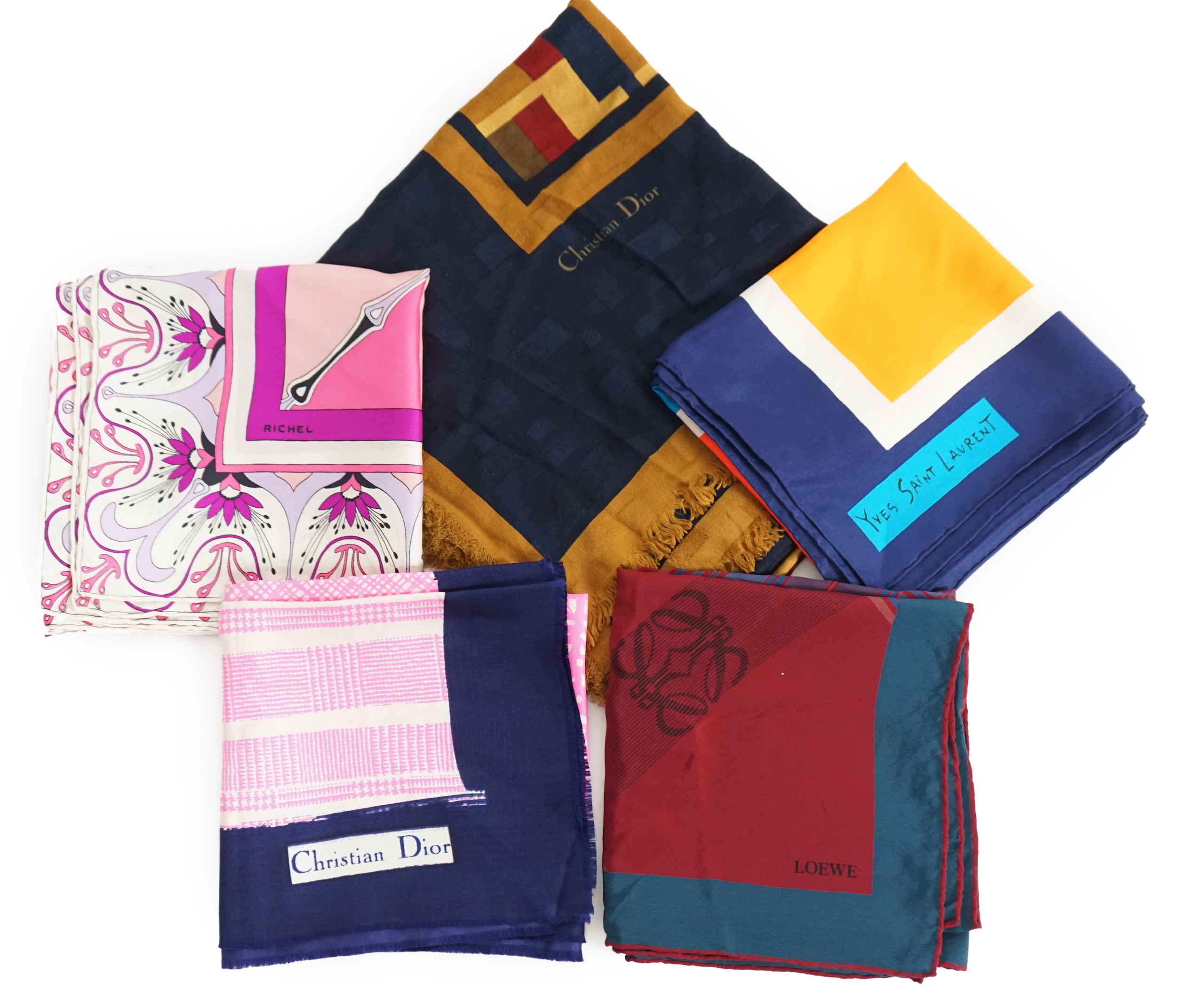 A selection of Yves Saint Laurent, two Christian Dior, Richel and Loewe silk scarves, YSL, 83cm x 85cm Christian Dior: 84cm x 80cm Richel: 87cm x 87cm Loewe: 86cm x 82cm Christian Dior large scarf 120cm x 130cm approx.